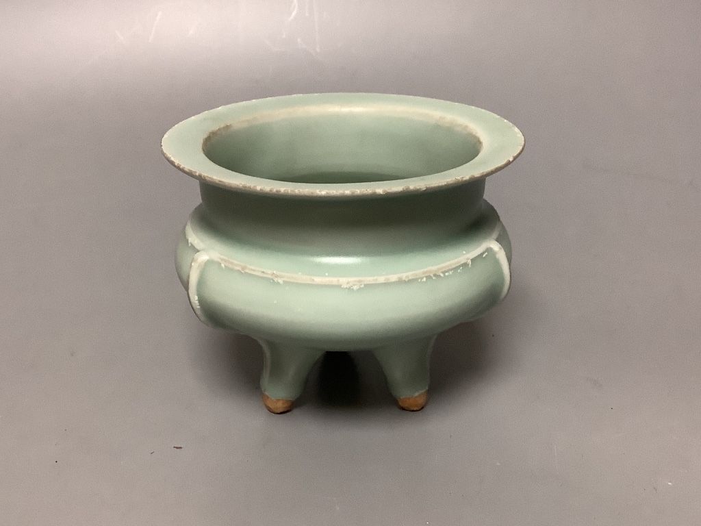 A Chinese celadon glazed tripod censer, diameter 11cm